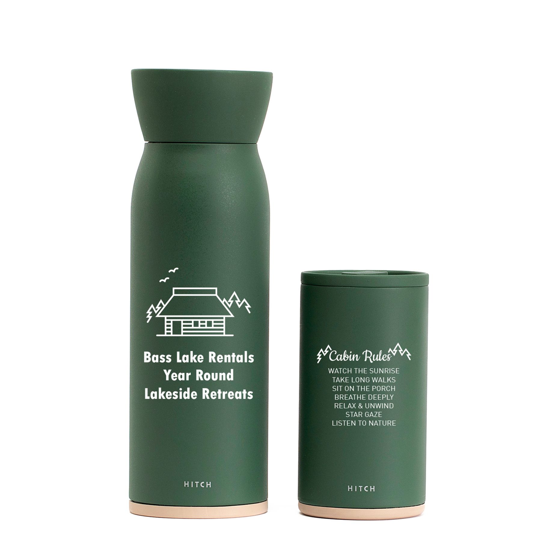 forest green cup with a house imprinted on it
